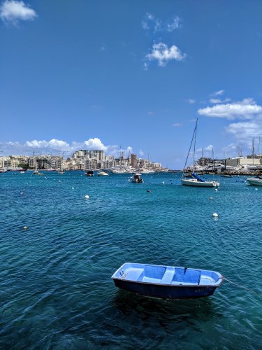 Little boat in bay in Malta
